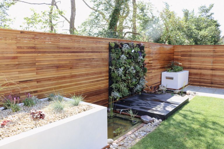 Living wall planter garden design with water feature